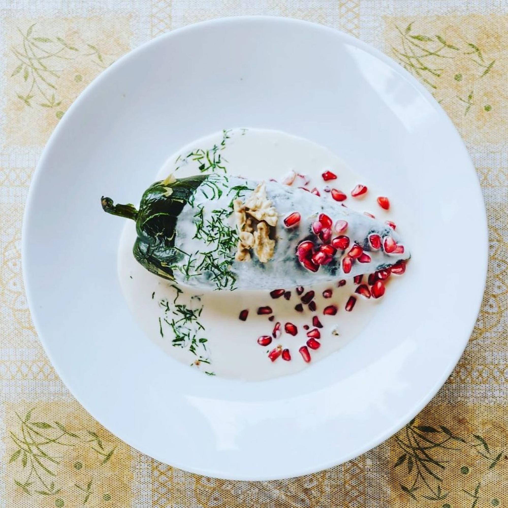 Large editorial shot of plated seasonal menu with layered composition